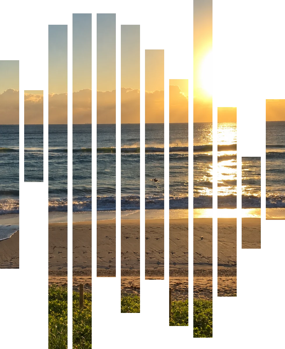 The sun over the ocean at HEED Beach, Hallandale Beach, seen through twelve slats shaped like the HEED symbol
